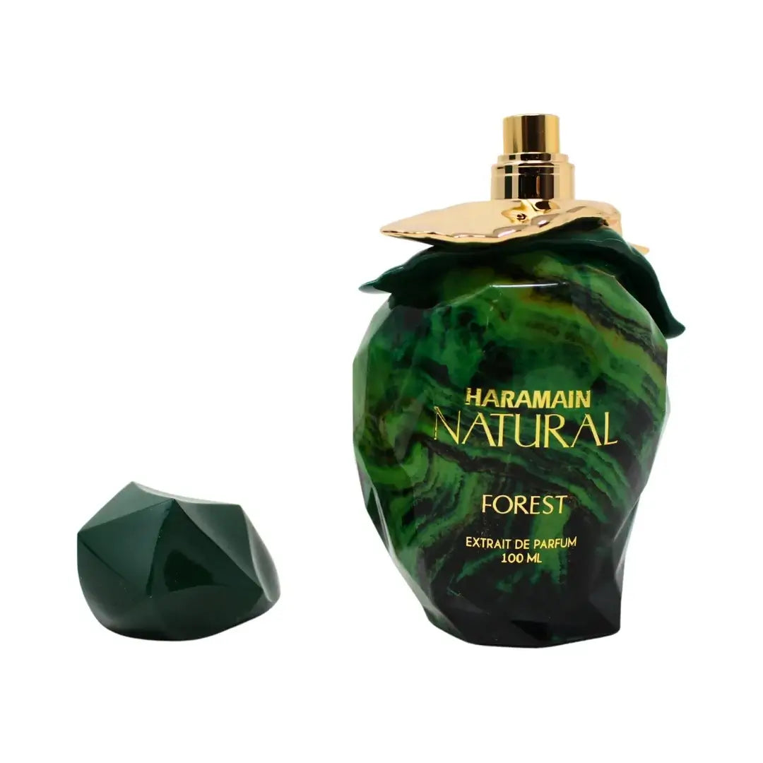 Haramain Natural Forest perfume bottle with green marbled design on a white background