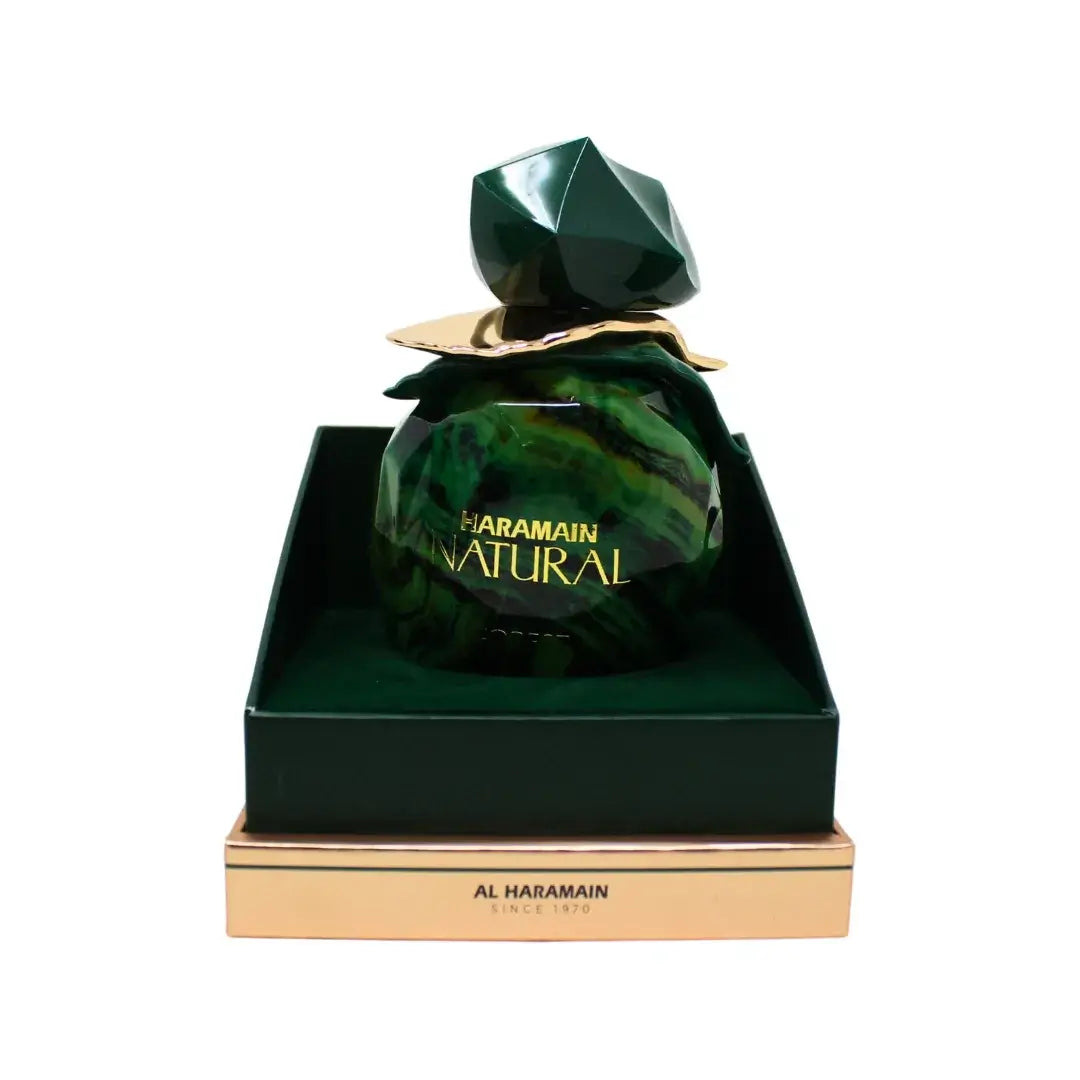 Haramain Natural Forest perfume bottle with green marbled design on a white background