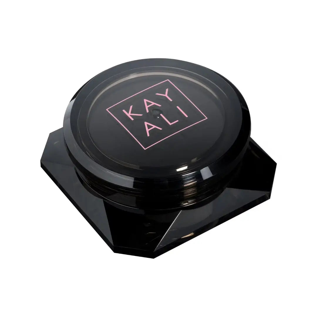 Black 'Oudgasm Rose Oud Perfumed Oud Wood' container with 'KAYALI' branding on a white background