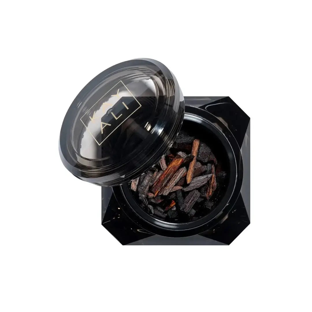 Oudgasm Vanilla Oud Perfumed Oud Wood container with lid featuring a Kayali logo on a white background