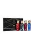 Set of four perfume bottles with gold caps in front of a black box labeled 'The Quad Collection' by 'Asateer' brand