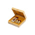 'Al Bairaq' Set of three small bottles in a wooden box on a white background with Al Jazeera Perfumes