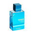 Blue perfume bottle labeled 'Haramain Amber Oud Aqua Dubai' on a white background