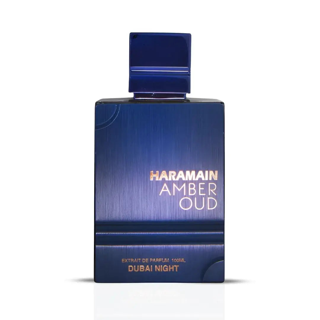 Blue perfume bottle labeled 'Haramain Amber Oud Dubai Night' on a white background