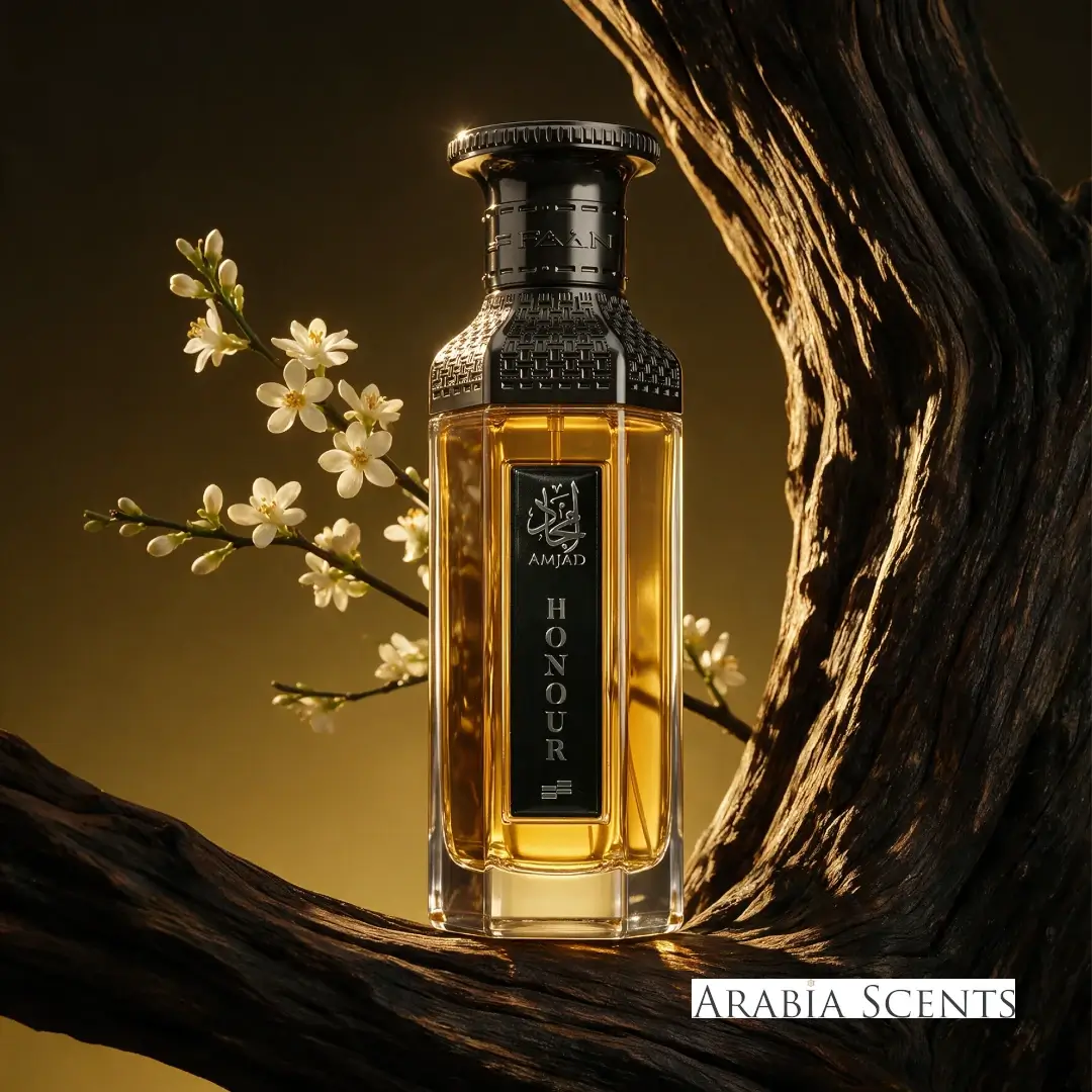 Amjad Honour gold and black perfume bottle branded by Faan Perfumes on a tree branch featured by 'ArabiaScents'