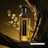 Amjad Honour gold and black perfume bottle branded by Faan Perfumes on a tree branch featured by 'ArabiaScents'