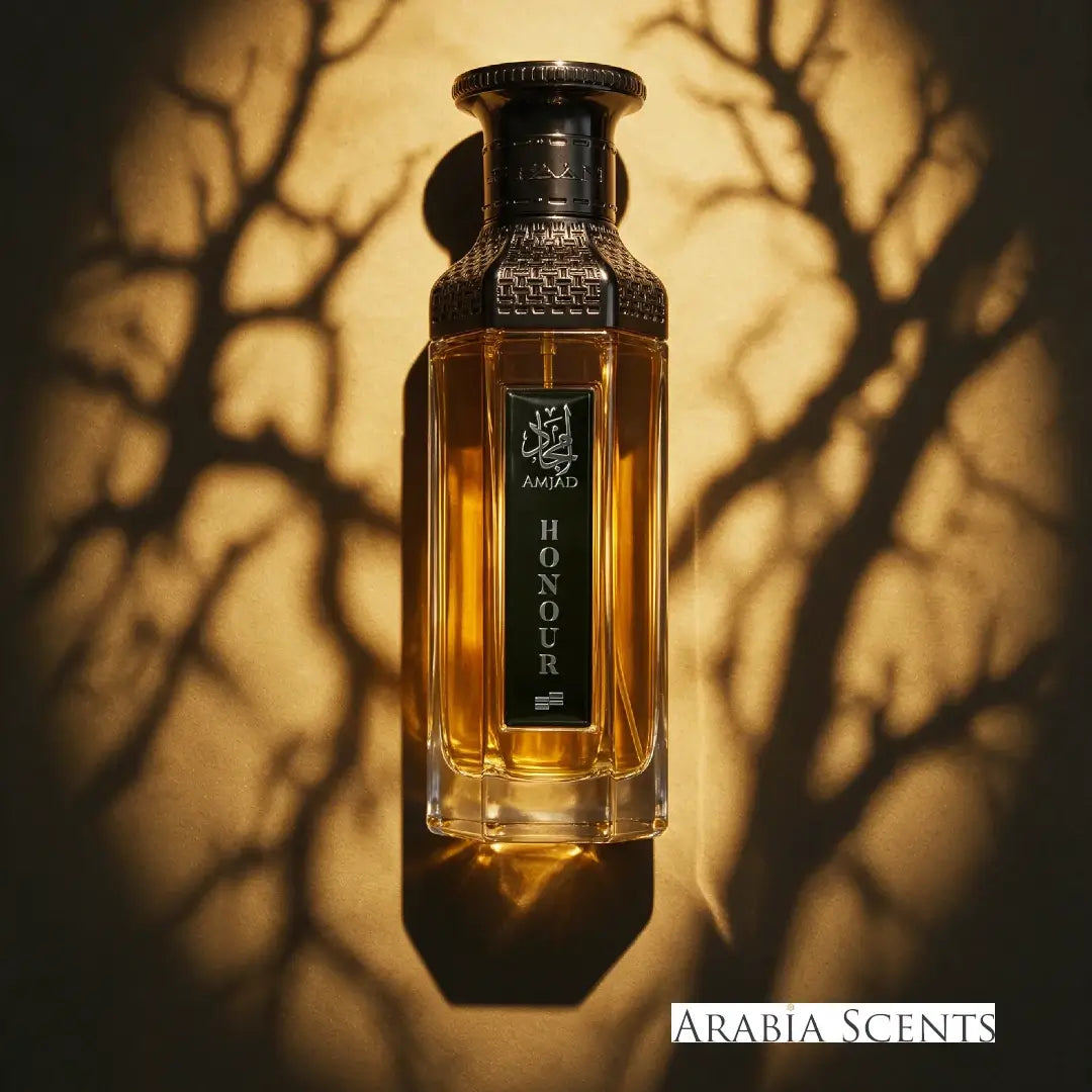 Amjad Honour gold and black perfume bottle branded by Faan Perfumes on a branch like background featured on 'ArabiaScents'