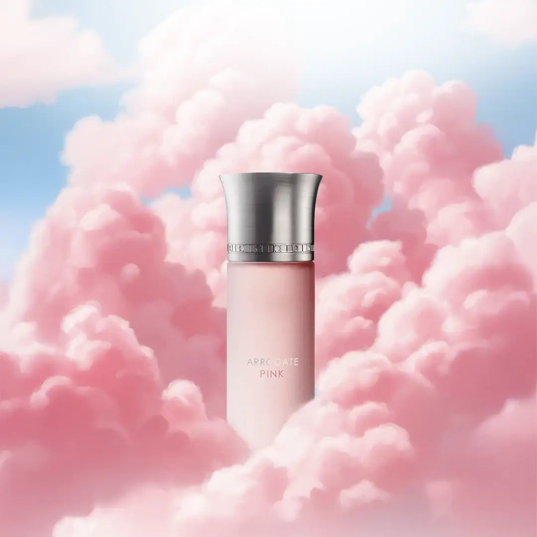'Pink Arrogate' perfume bottle with silver cap against a pink cloud background branded 'Assaf'