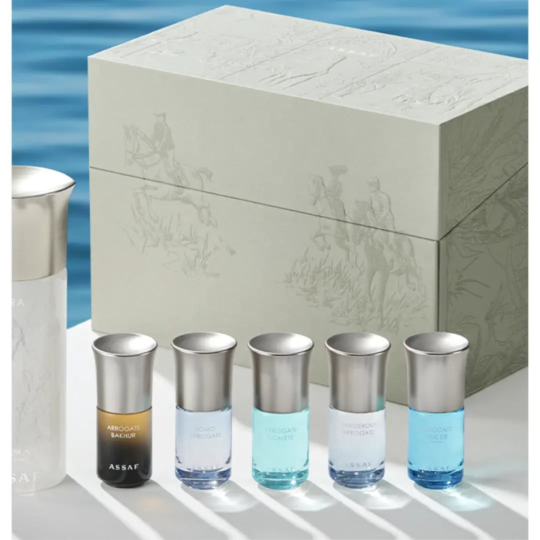 'Aura Collection 35' Set of perfume bottles with a decorative box against a blue water background branded 'Assaf'