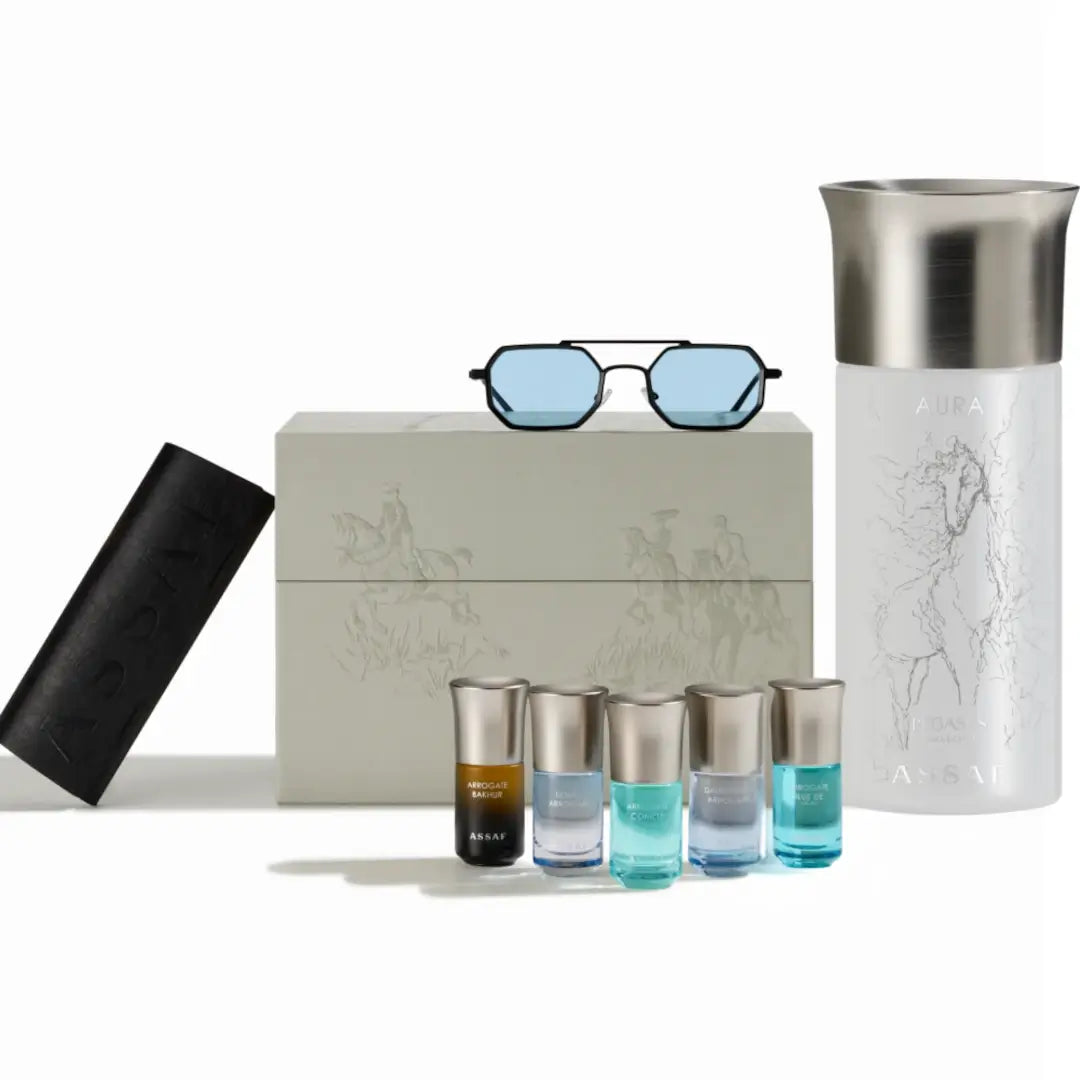 'Aura Collection 35' of perfume bottles, sunglasses, and a box on a white background branded 'Assaf'