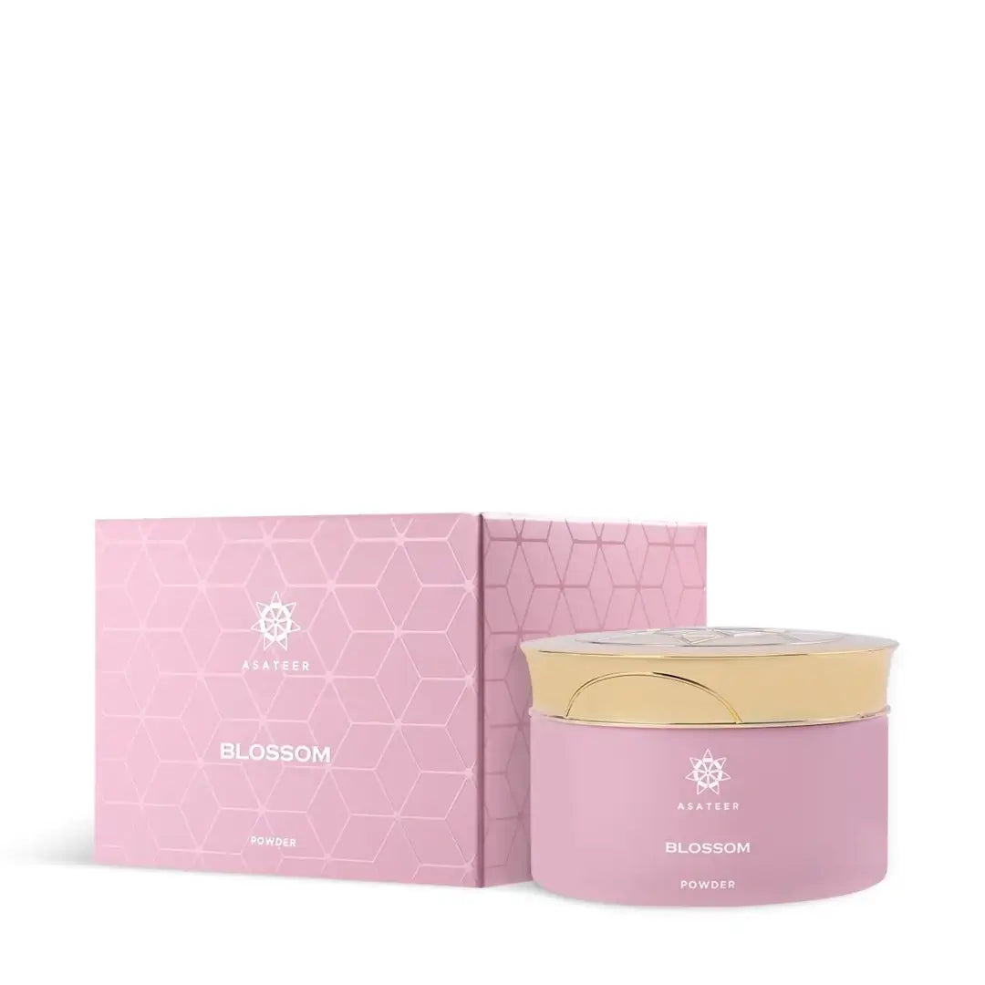 'Blossom Scented Body Powder' by Asateer pink container with a gold lid on a white background