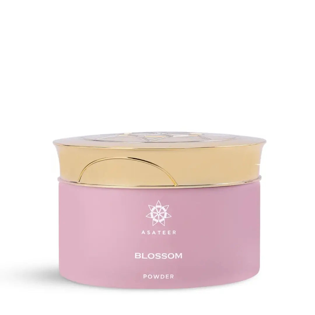 'Blossom Scented Body Powder' by Asateer pink container with a gold lid on a white background