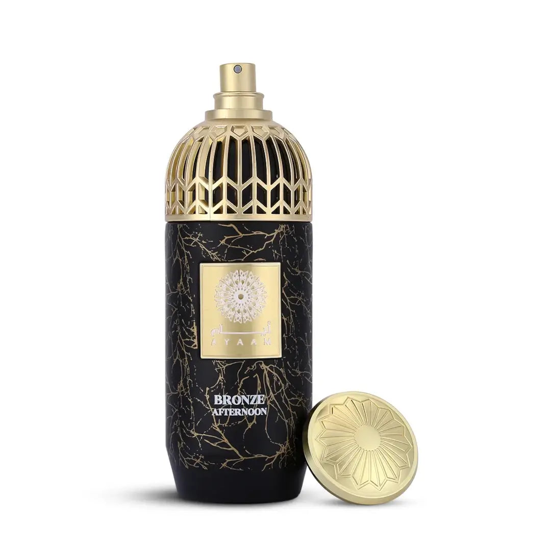 'Bronze Afternoon' perfume bottle with intricate design on a white background with 'Ayaam' branding