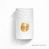 White perfume bottle labeled 'Caramel Latte' by Le Bonheur featured by Arabia Scents on a light background