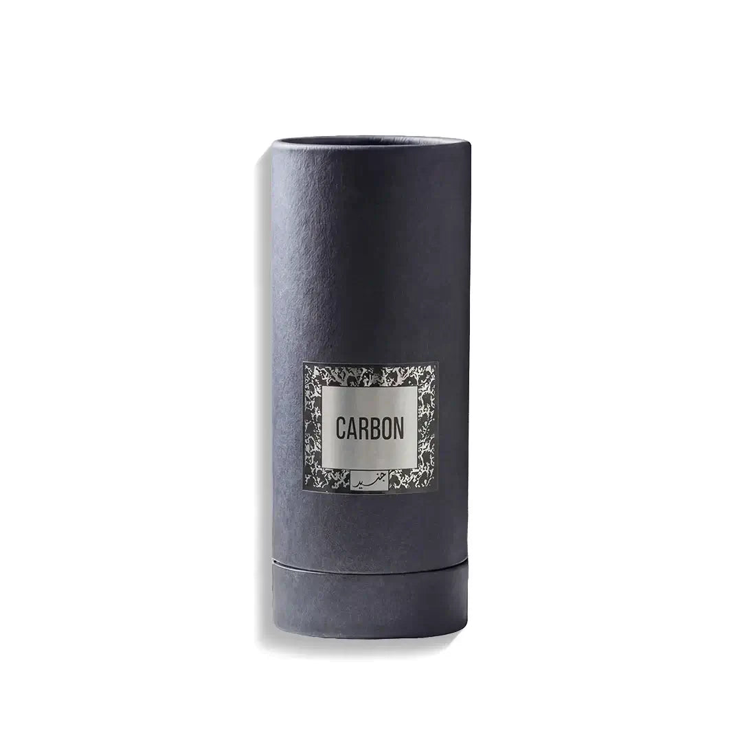 Dark gray cylindrical perfume container with 'CARBON' label on a white background branded Junaid