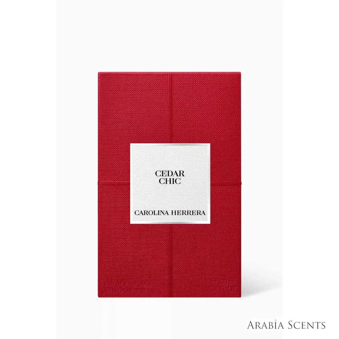 'Cedar Chic' perfume packaging on a white background with 'Carolina Herrera' branding featured by 'Arabiascents'