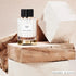 'Cedar Chic' perfume bottle with 'Carolina Herrera' branding featured by 'Arabiascents'