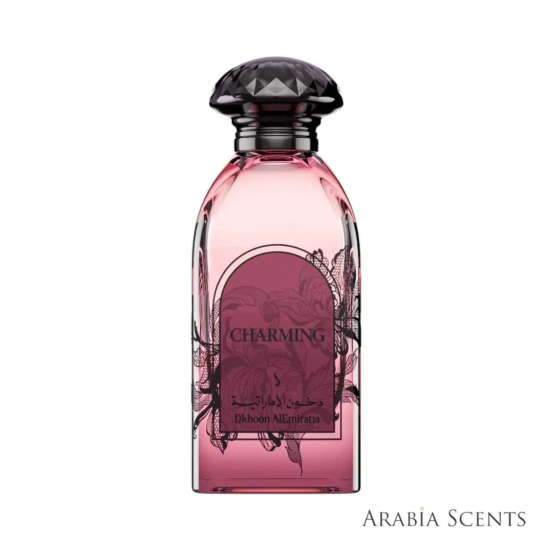 Decorative Pink perfume bottle with  'Charming' label branded Dkhoon Emirates on a white background featured by ArabiaScents