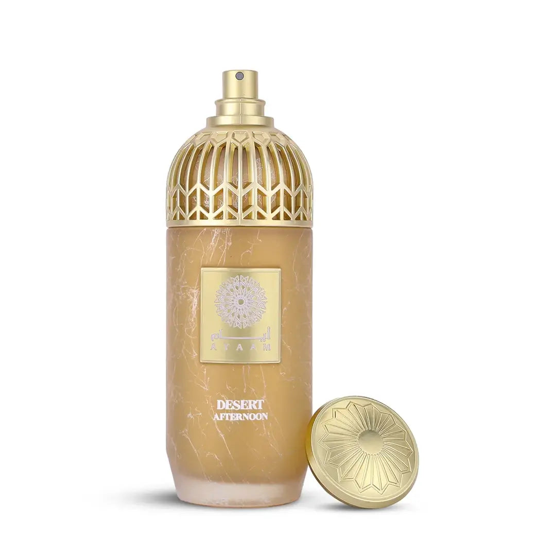 Gold and beige perfume bottle with 'Desert Afternoon' label on a white background with 'Ayaam' branding