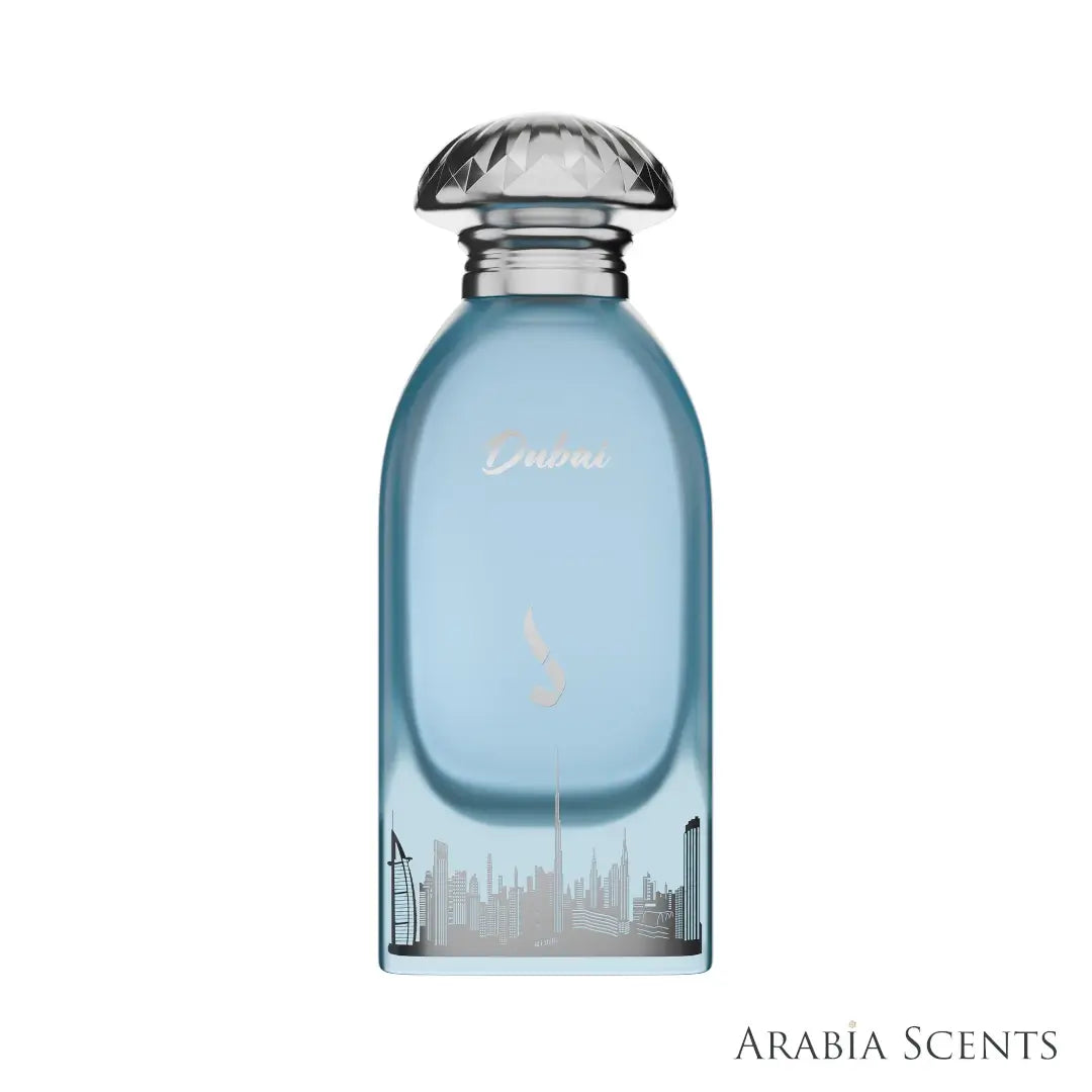 'Dubai' Blue perfume bottle with silver cap and cityscape design on a white background branded by Dkhoon Emirates, featured by Arabia Scents