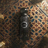 Emarati Imperial perfume bottle with decorative label on a patterned surface branded by Gissah