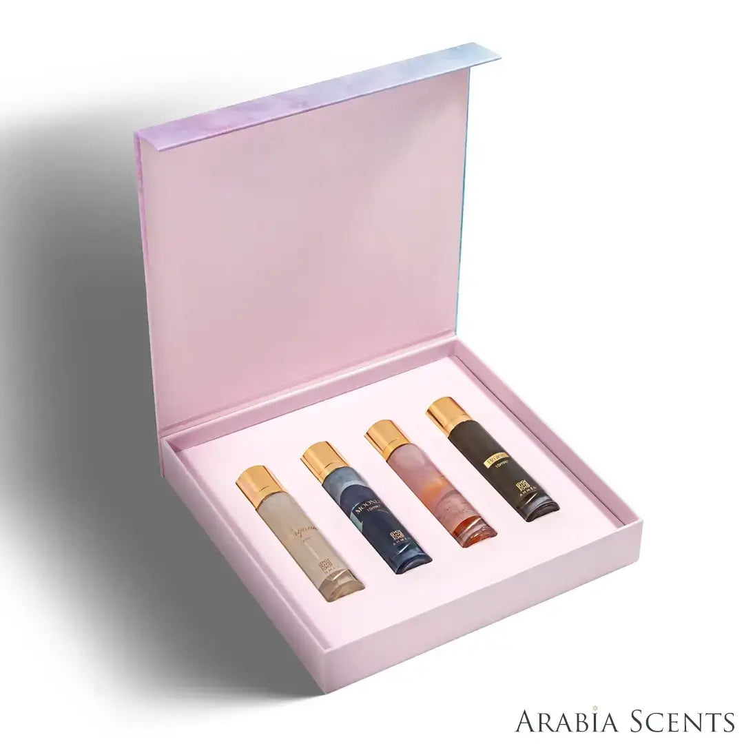 'Fragrance Collection For Her' perfume bottles set & packaging on a white background with 'Ahmed Al Maghribi' branding featured by 'Arabiascents'