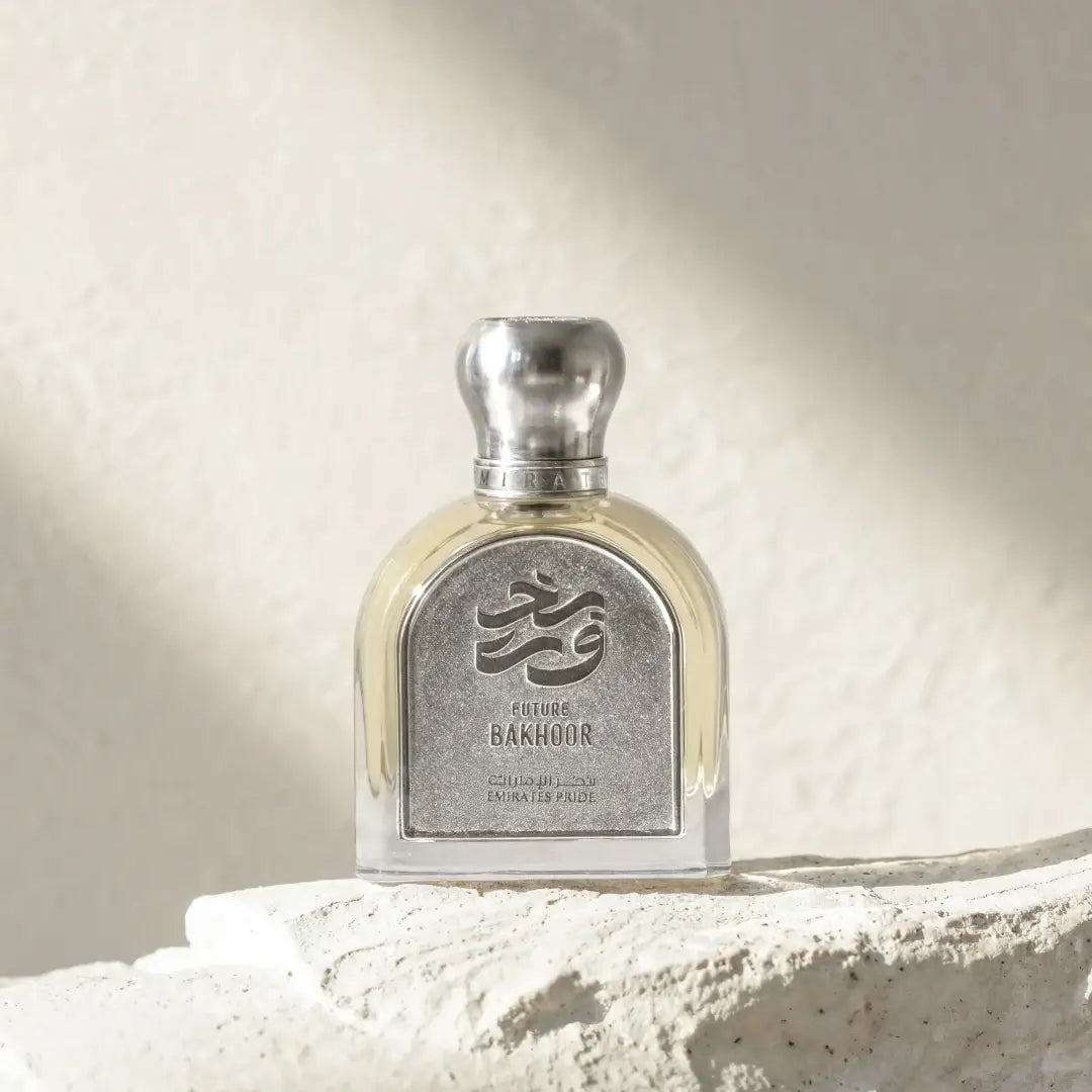 'Future Oud' Perfume bottle with silver cap and label on a textured surface branded Emirates Pride