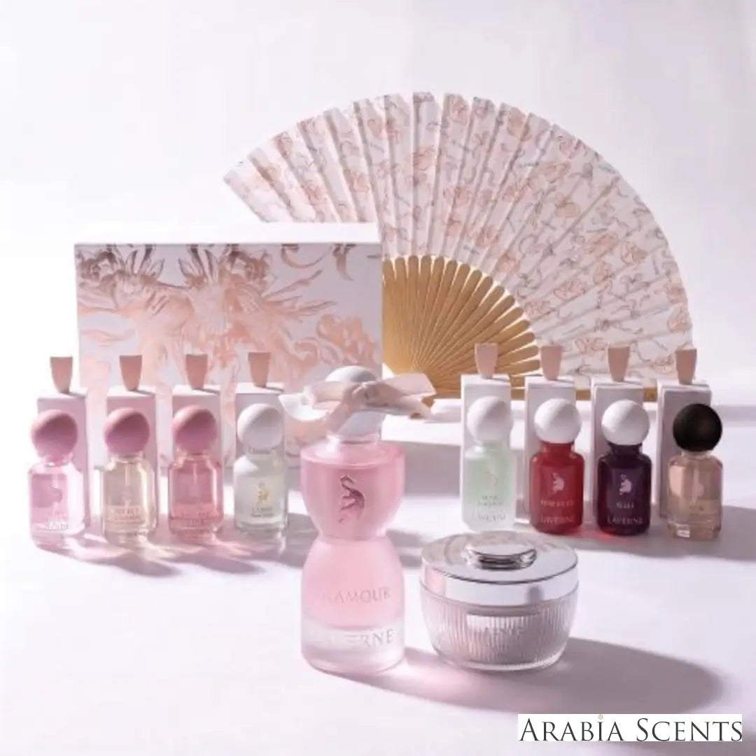 'Glamour World' set perfume bottles & powder on a white background with 'Laverne' branding featured by 'Arabiascents'