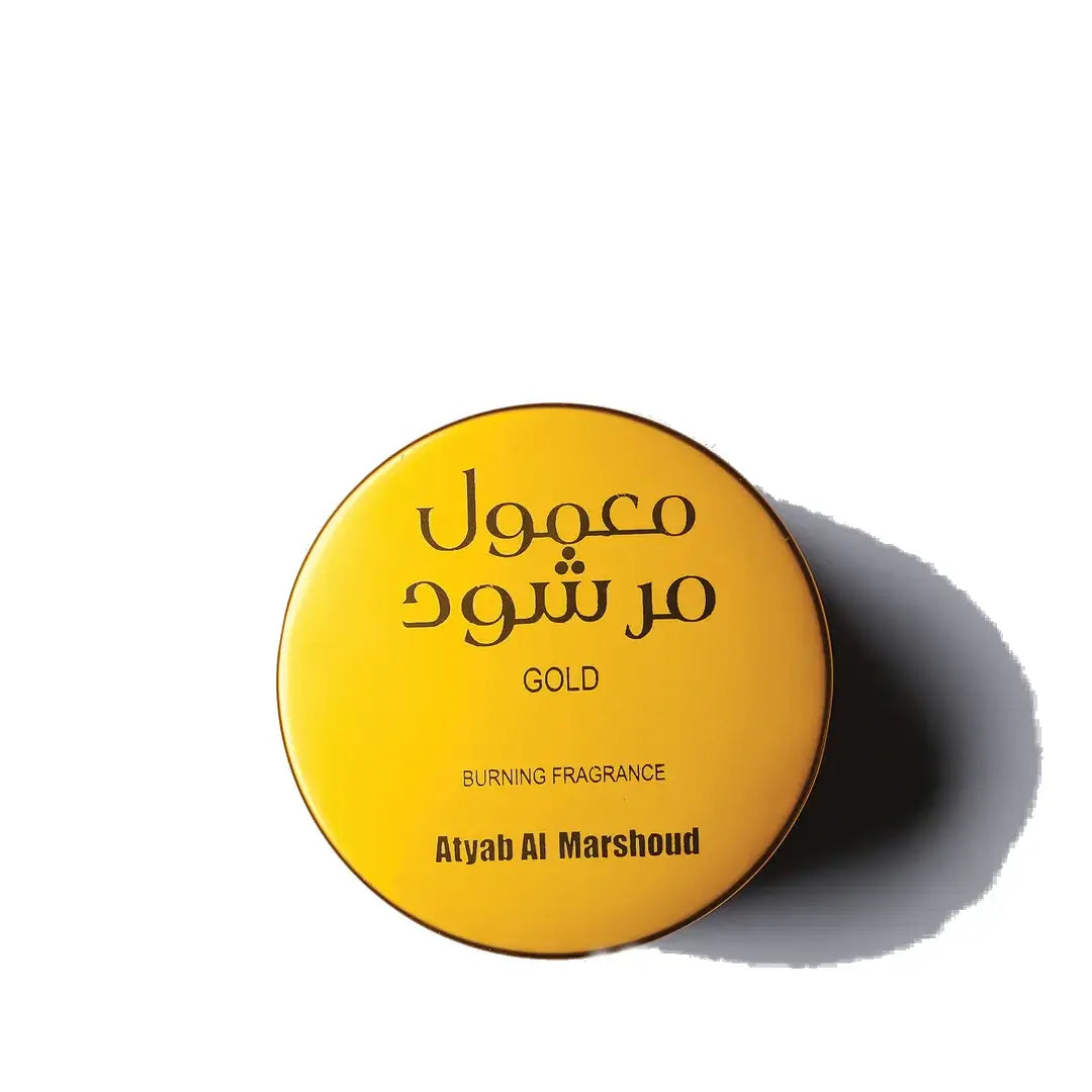 'Gold Maamoul' Yellow container with  and 'Atyab Al Marshoud' branding on a white background