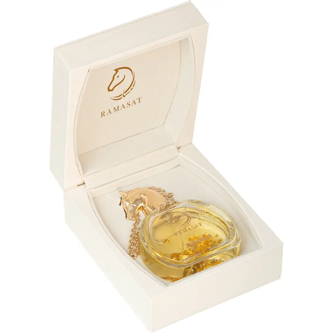 'Jawareh' Perfume bottle & packaging  with gold horse design on a white background with 'Ramasat' branding