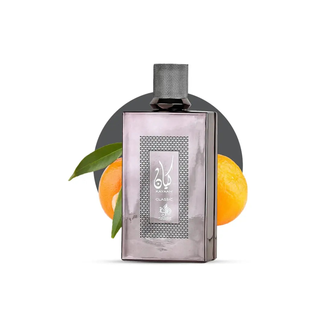 Kayaan Classic Perfume bottle with oranges and a leaf on a white background branded Al Wataniah