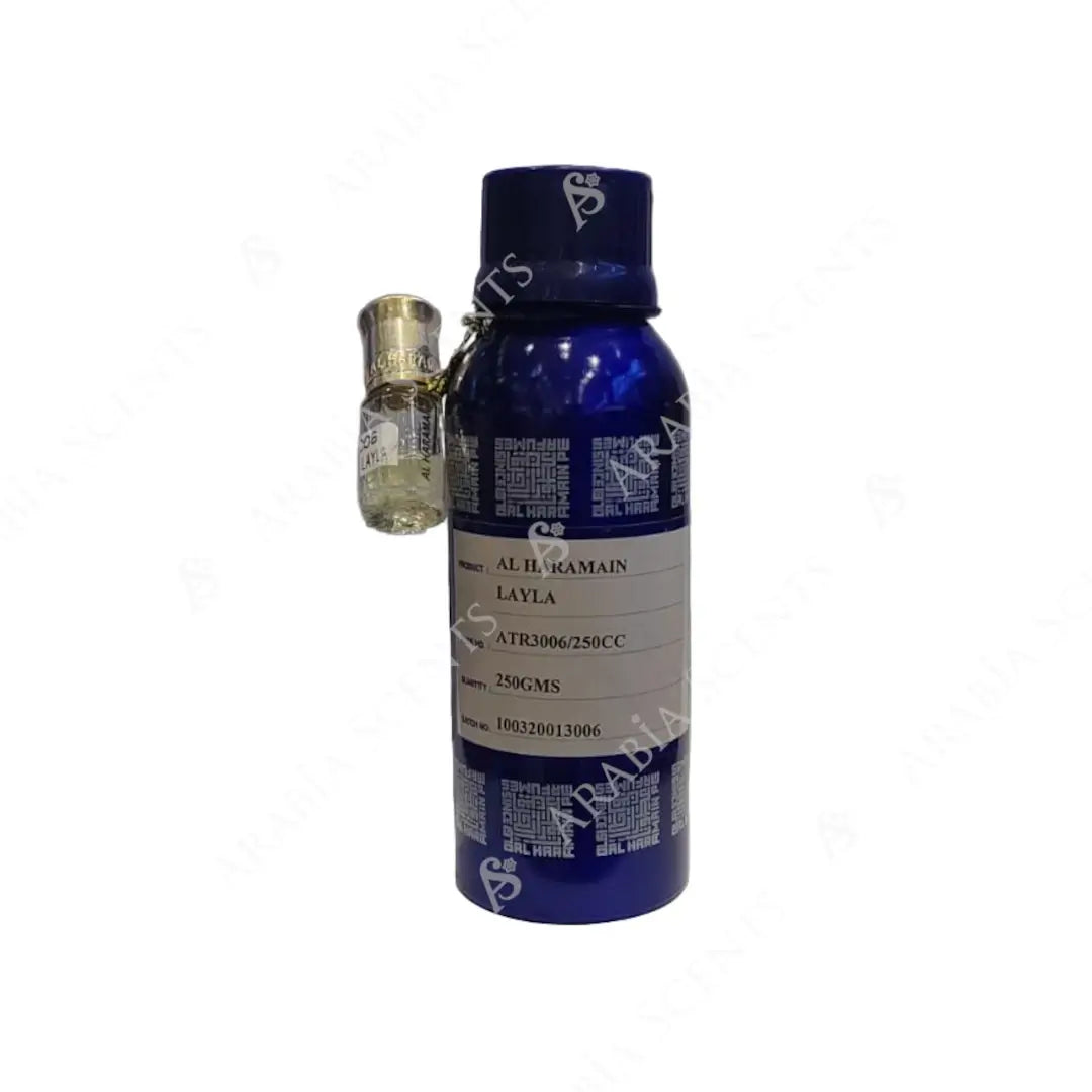 Blue 'Al Haramain Layla' perfume oil bottle with a smaller gold bottle on a white background