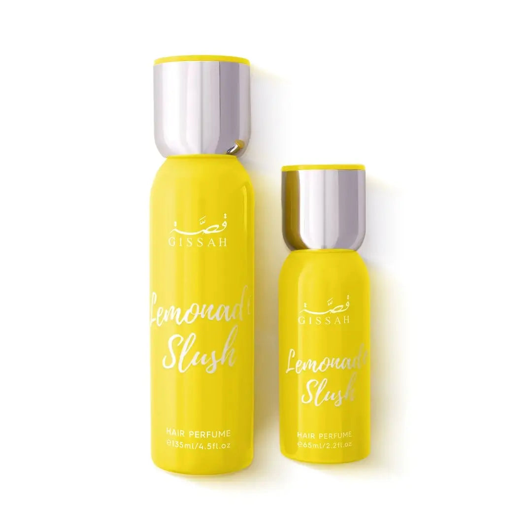 Two yellow bottles of 'Lemonade Slush' hair perfume with silver caps on a white background by Gissah Perfumes