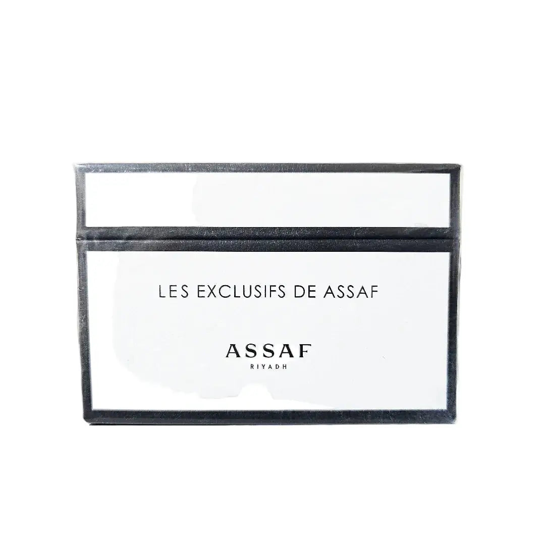 Rectangular black frame with 'LES EXCLUSIFS DE ASSAF' and 'ASSAF RIYADH' text on a white background