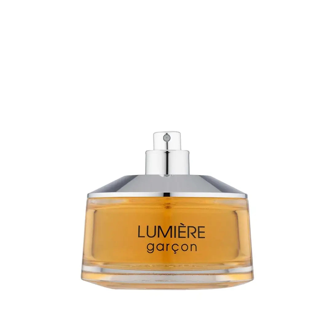 Lumiere Garcon Perfume bottle without a cap and gold base on a white background branded French Avenue