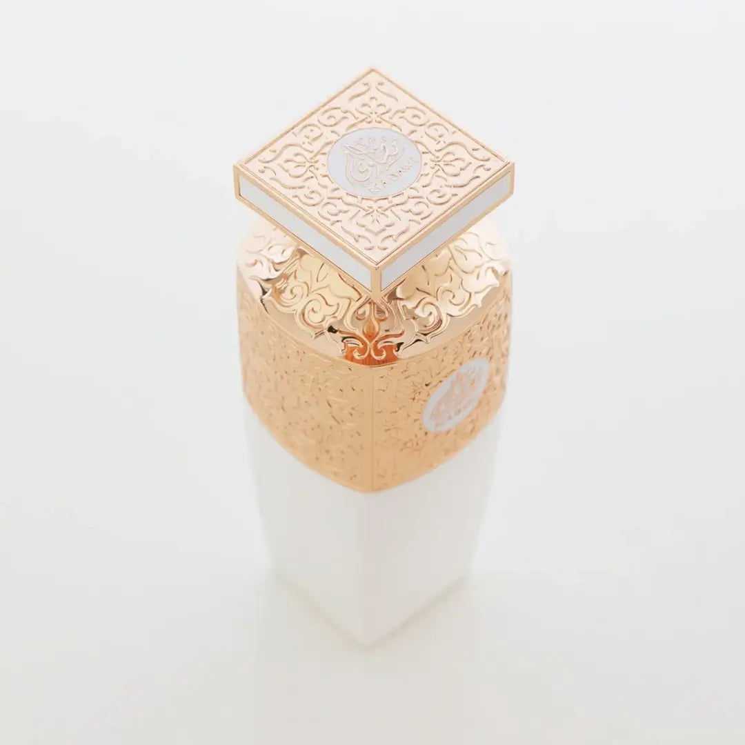 'Madawi White' Gold decorative perfume bottle on a white background branded Arabian Oud