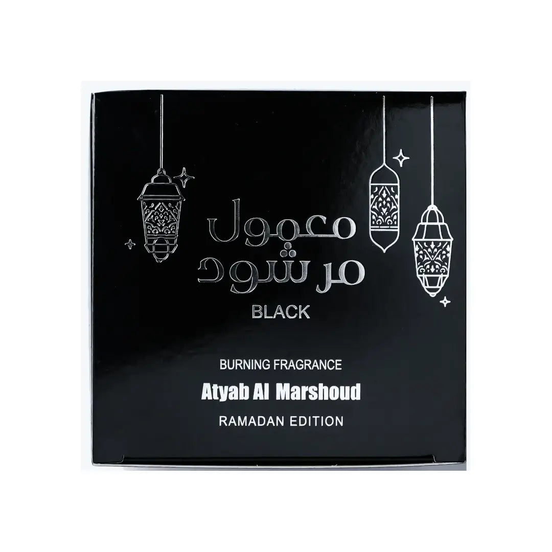 Black packaging of Atyab Al Marshoud Mamool Black Ramadan edition with white text and lantern designs.