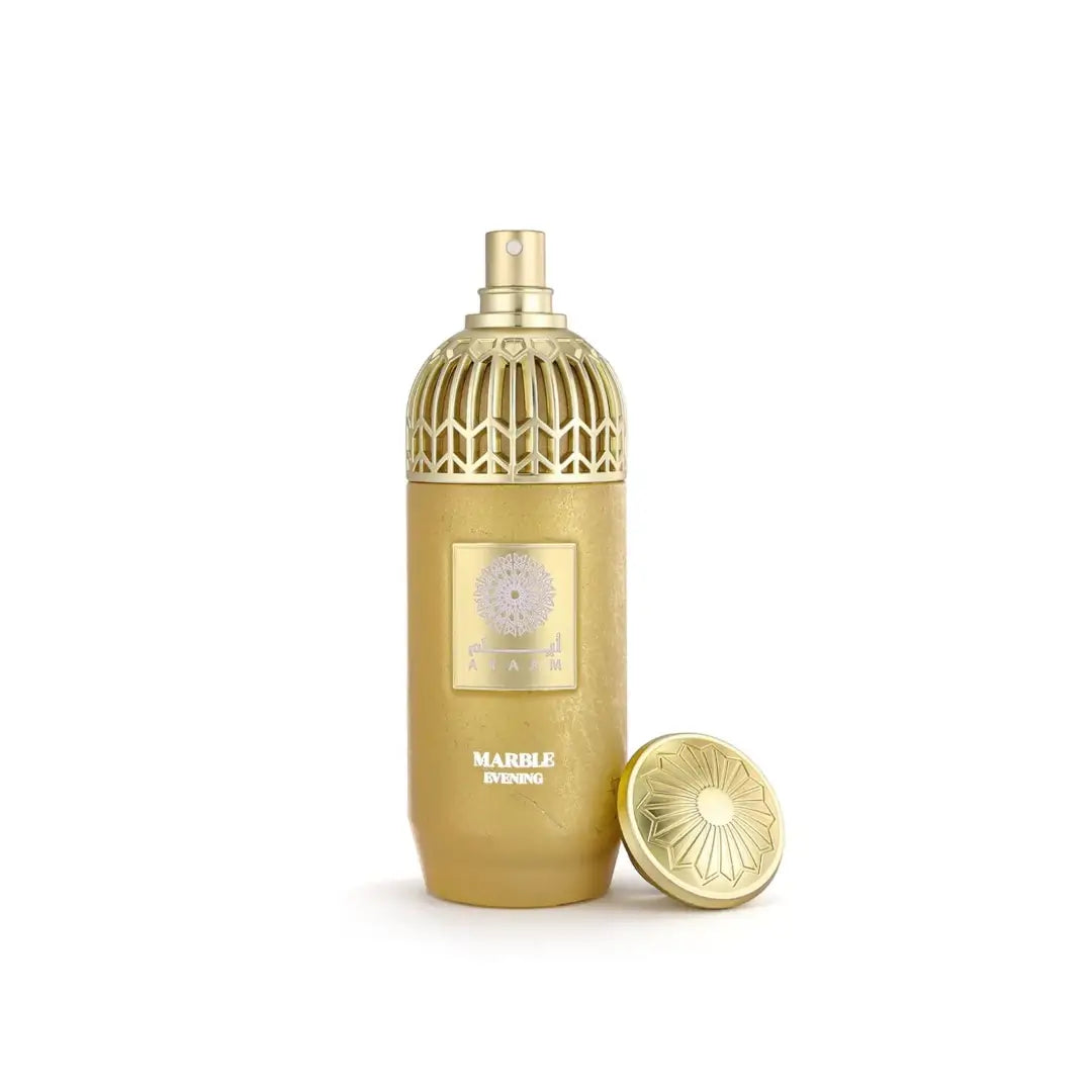 'Marble Evening' gold perfume bottle with intricate design on a white background with 'Ayaam' branding