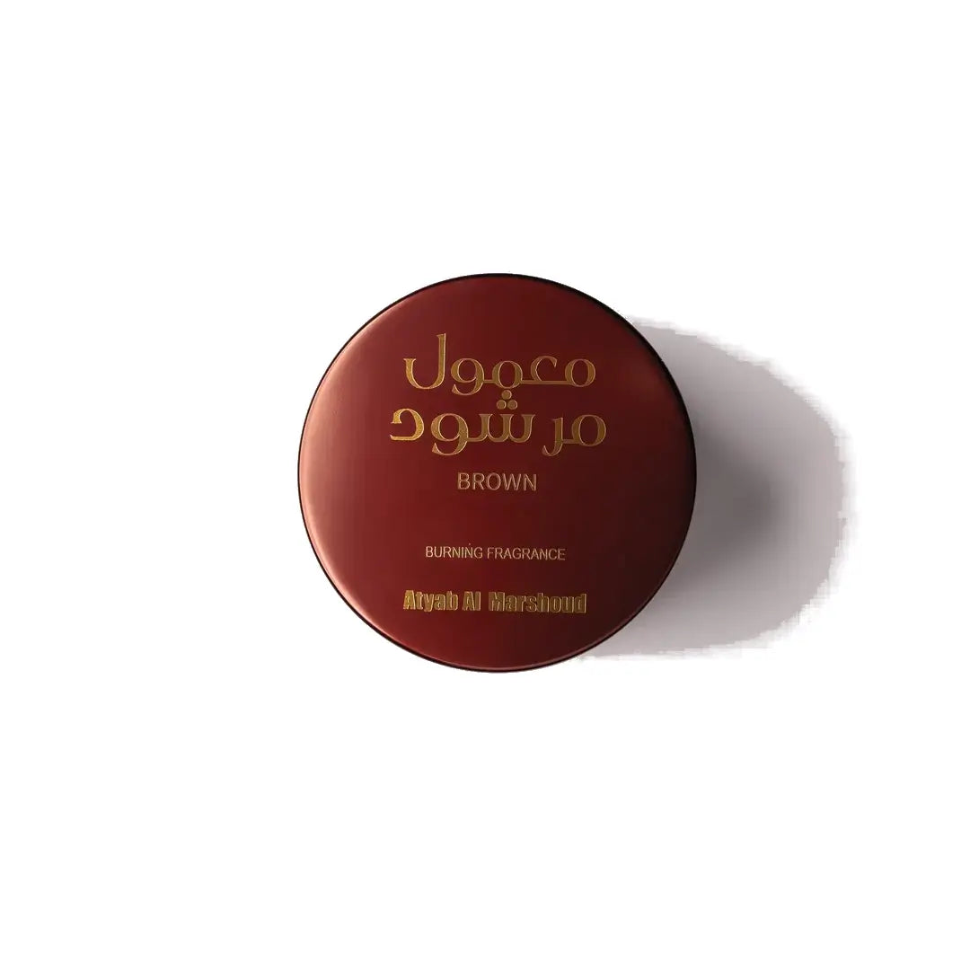 'Maroon Maamoul' Round brown container with gold text on a white background branded 'Atyab Al Marshoud'
