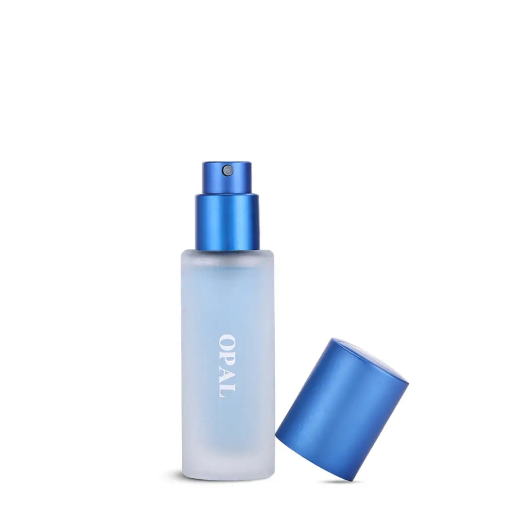 Blue spray bottle with a matching cap on a white background, named 'Opal' branded by Ayaam