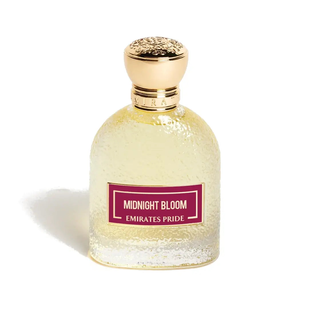 Perfume bottle labeled 'Midnight Bloom Emirates Pride' with a gold cap on a white background