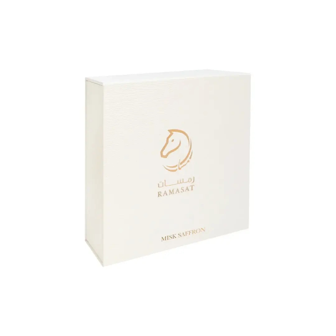 'Misk Saffron' perfume bottle with horse-shaped cap & packaging on a white background with 'Ramasat' branding