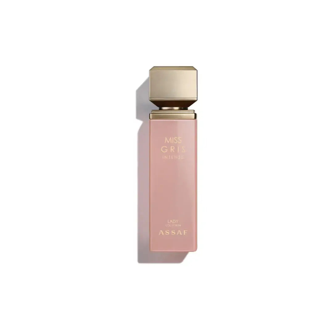 Pink perfume bottle labelled 'Miss Gris Intense' with gold cap on a white background with Assaf branding