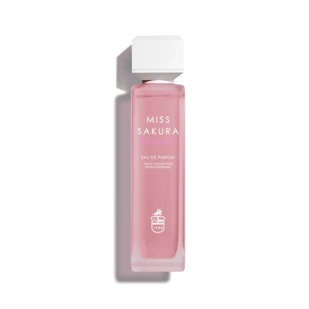 Pink perfume bottle labeled 'Miss Sakura' by Assaf on a white background