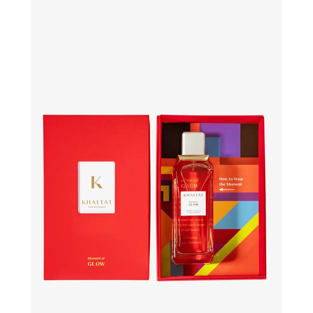 'Moment Of Glow' perfume bottle & packaging in a white background with 'Khaltat' branding