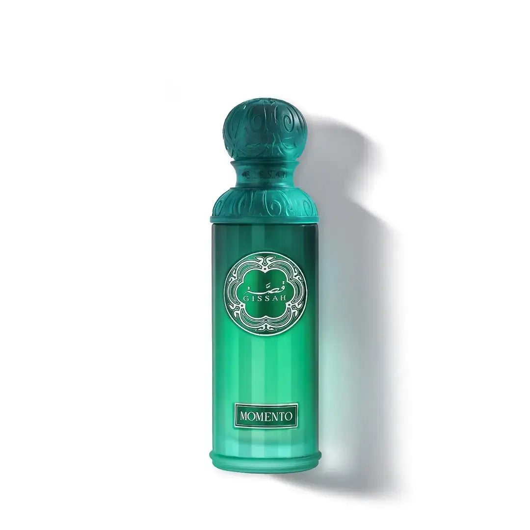 'Momento' Green perfume bottle with decorative cap on a white background with Gissah branding