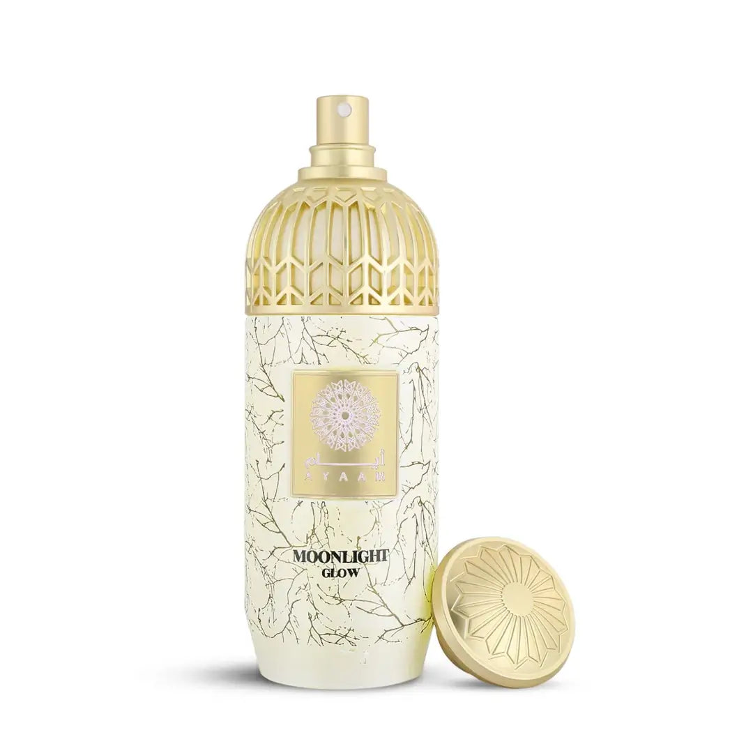 'Moonlight Glow' perfume in a decorative bottle with gold cap and floral design on a white background with 'Ayaam' branding