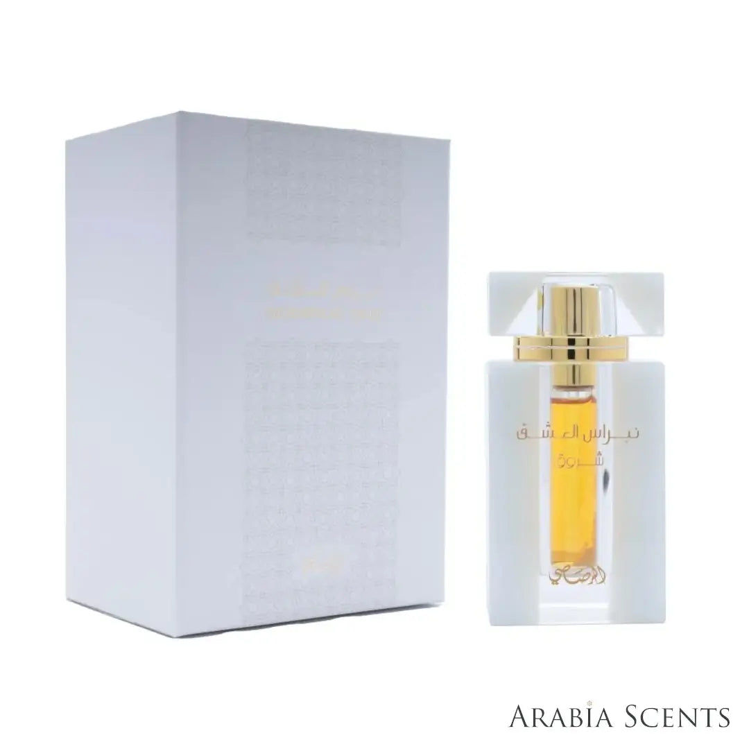 'Nebras Al Ishq' perfume bottle & packaging on a white background with 'Rasasi' branding featured by 'Arabiascents'