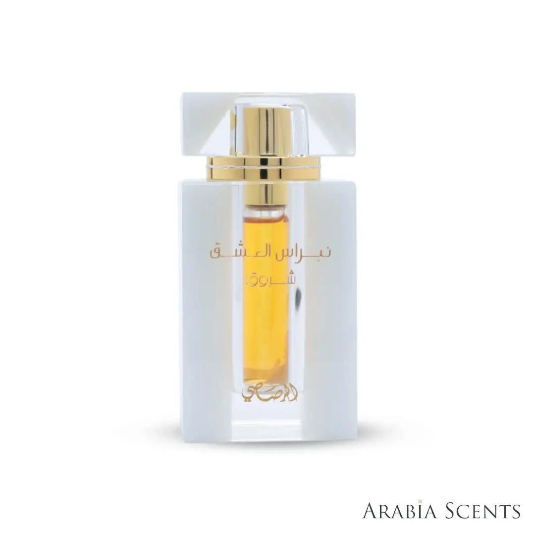 'Nebras Al Ishq' perfume bottle on a white background with 'Rasasi' branding featured by 'Arabiascents'