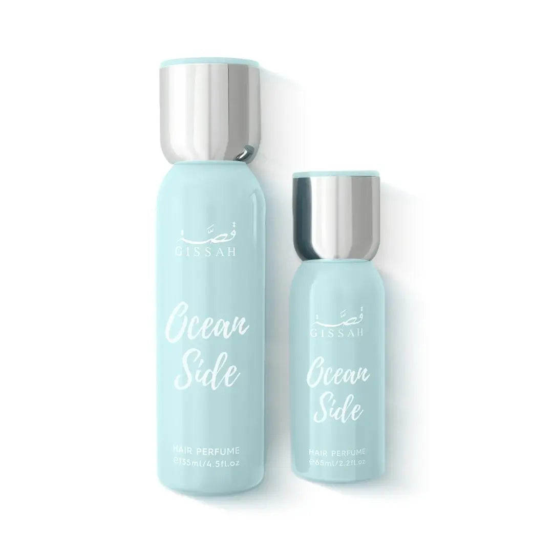 Two bottles of 'Ocean Side' hair perfume by Assouad on a white background by Gissah Perfumes